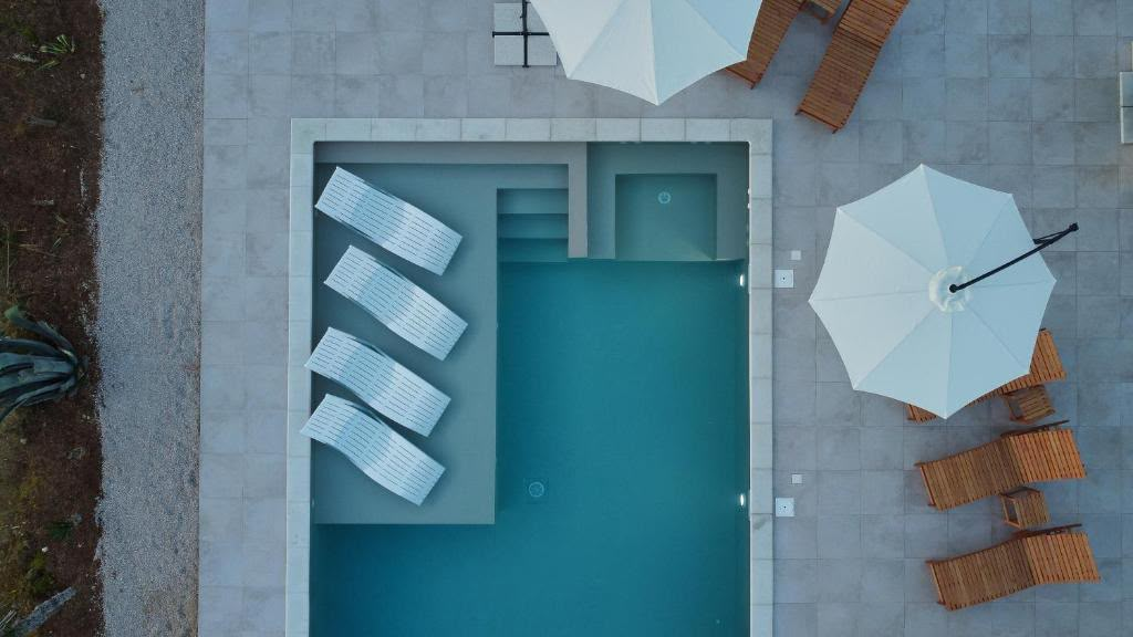 Modern Mediterranean villa with pool at dusk